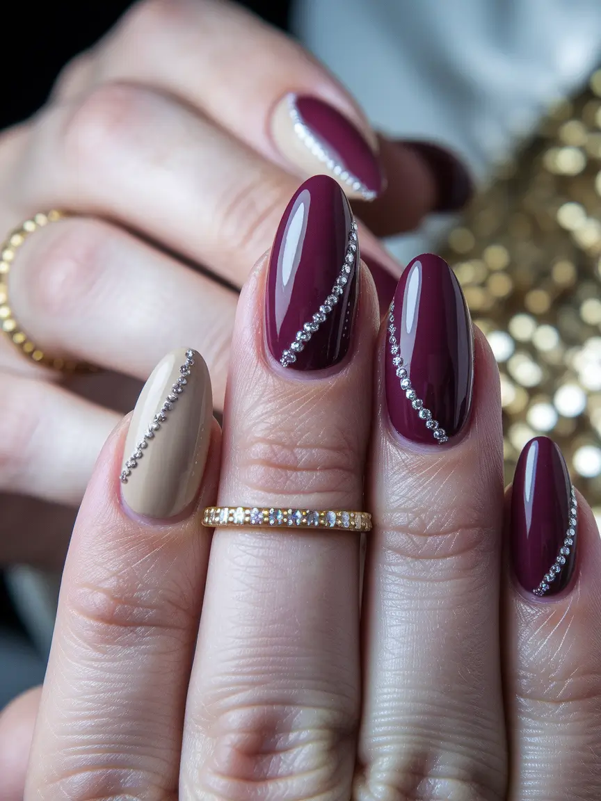 fall almond nails 2025 Garnet and Nude with Crystal Sweep