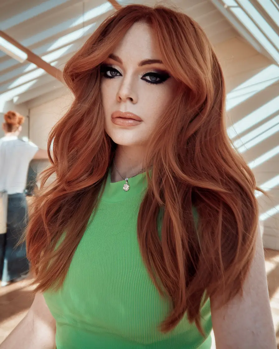 fall red hair color strawberry spice layers with curtain bangs