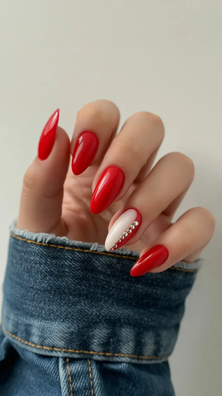 acrylic nail designs 2026 Classic Red Almond with a Crystal Accent