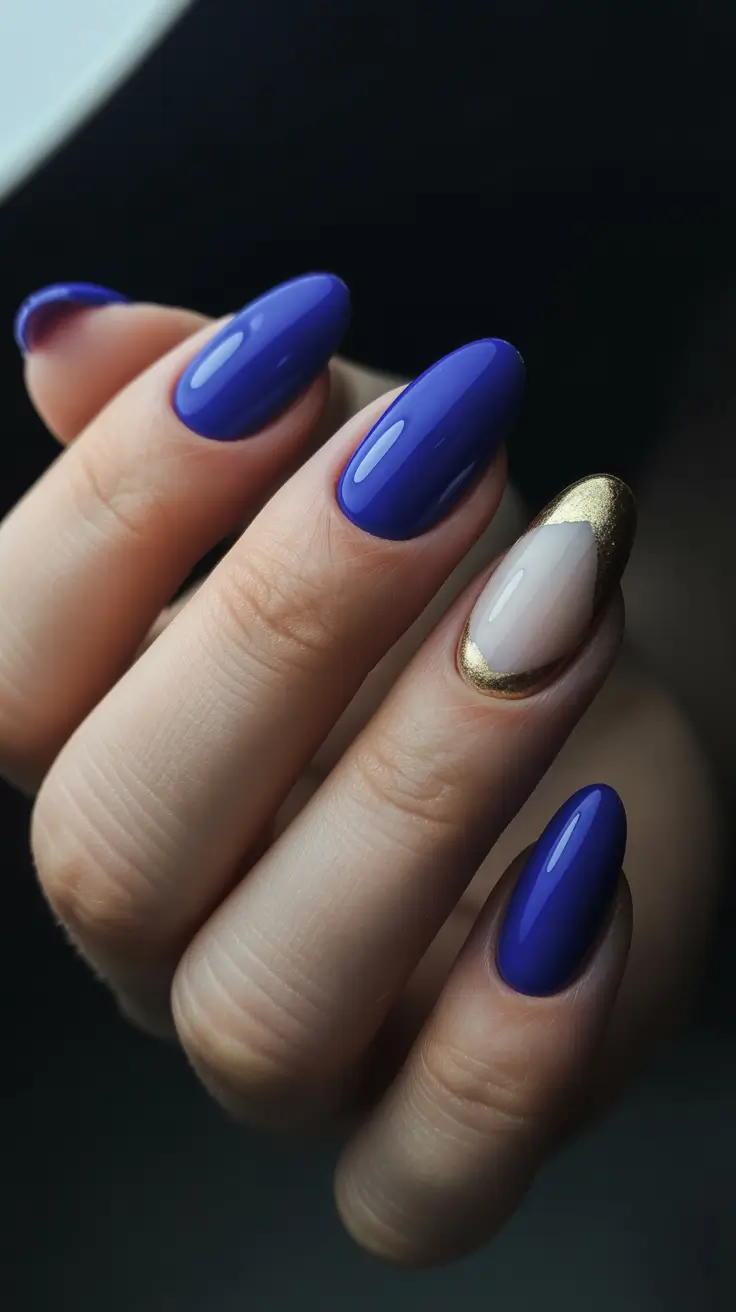 almond nail designs 2026 Royal Blue Shine With Metallic Gold Accent