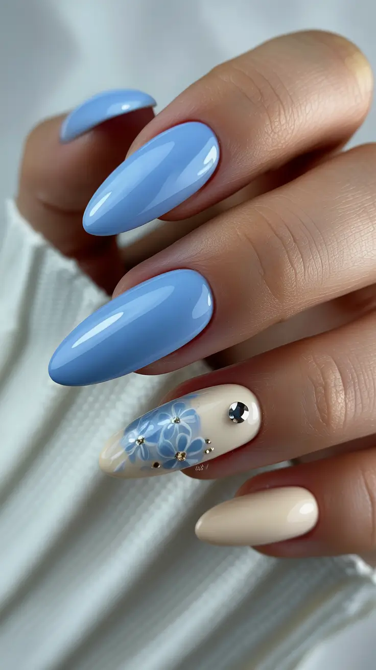 april nails ideas 2026 Elegant Blue Floral Almond Nails for Classy Spring Moments