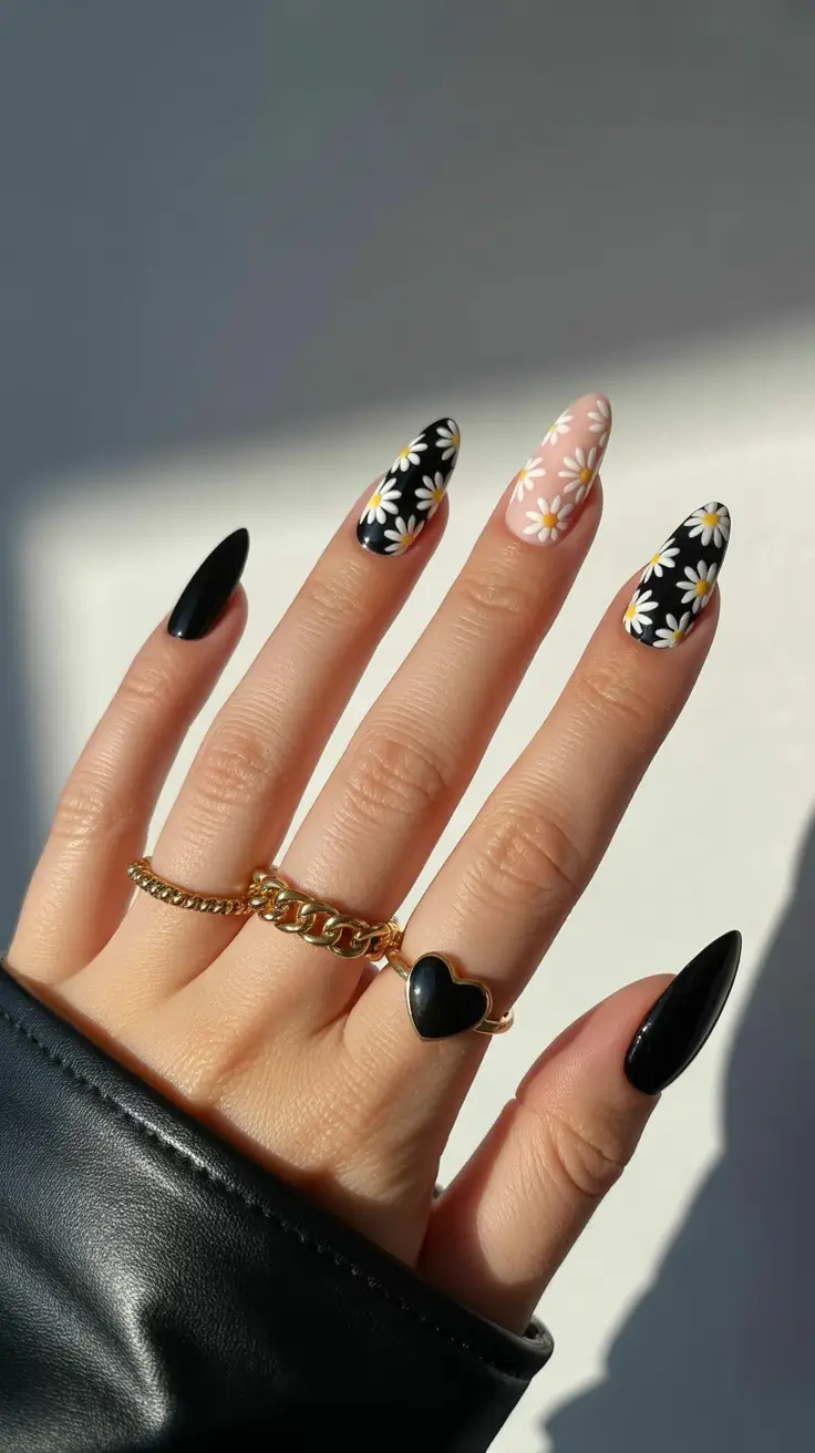 april nails ideas 2026 Black Daisy Almond Nails for Edgy Spring Contrast