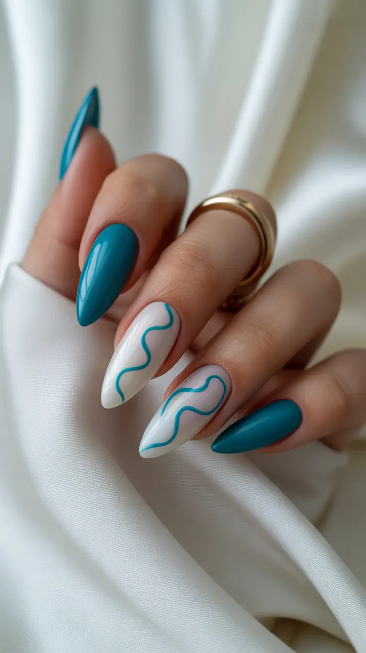 april nails ideas 2026 Graphic Teal Almond Nails with Modern Classy Lines