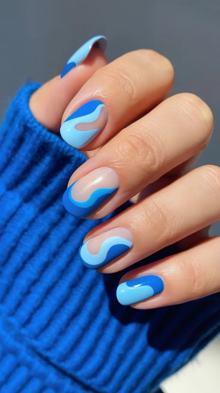 sophisticated spring gel nails polish 2026 Soft Blue Flow Gel Nails with Modern Wave Art