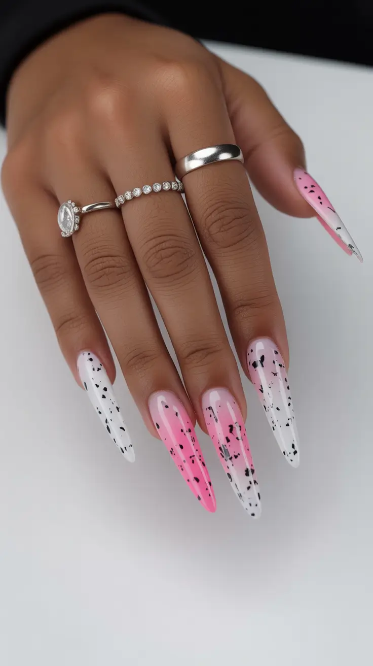 sophisticated spring gel nails polish 2026 Pink and White Speckled Stiletto Gel
