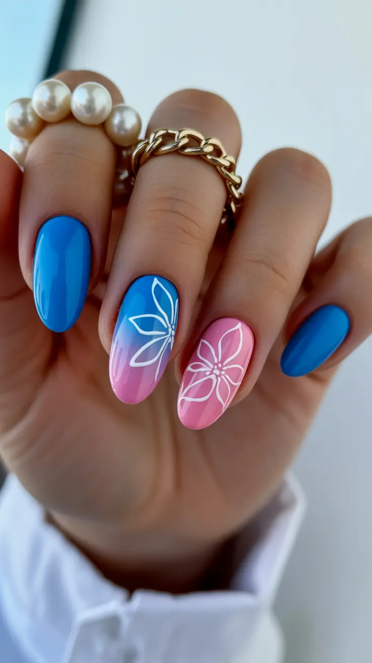 vibrant spring nail design 2026 Bright Blue and Pink Ombre Floral Spring Nails