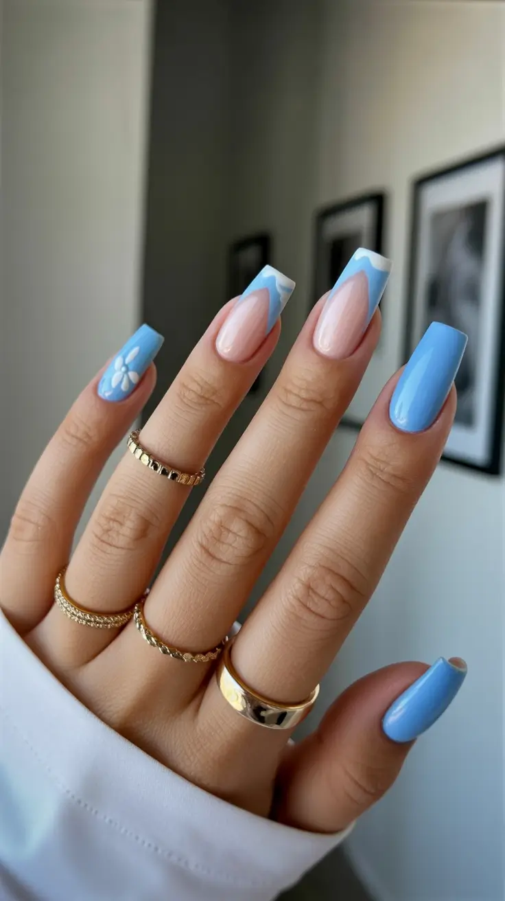 vibrant spring nail design 2026 Soft Blue Spring Nails With Daisy Accent